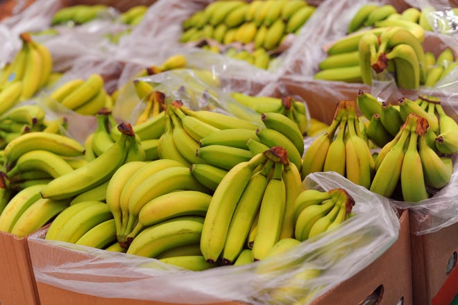 Ripe bananas on boxes in the supermarket
