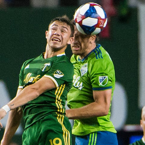 Portland Timbers forward Tomas Conechny (19) and S