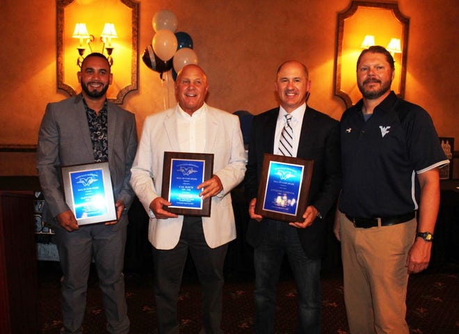 Wayne Valley football Hall of Fame inductees: (from left) Matt Dortch, Cal Koch and Anthony Campana with coach Roger Kotlarz.