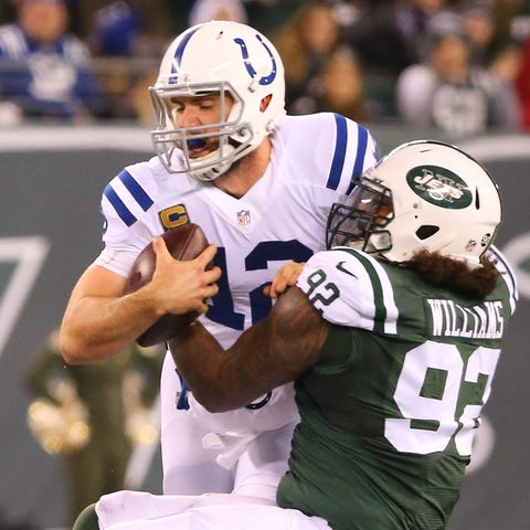 Andrew Luck is sacked by New York Jets defensive t