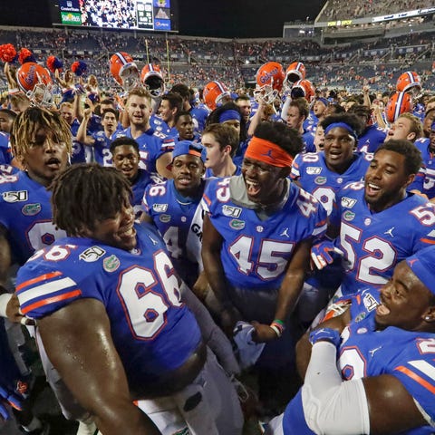 Florida players celebrate after defeating Miami 24