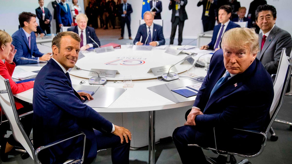 French President Emmanuel Macron   and President Donald Trump attend  a working session on "International Economy and Trade, and International Security Agenda" on the second day of the annual G7 summit in Biarritz, France.