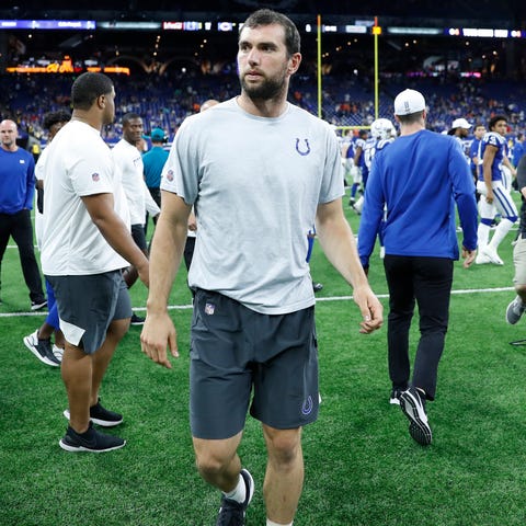 Andrew Luck walks off the field after the Indianap