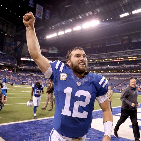 Colts quarterback Andrew Luck joyously runs off th