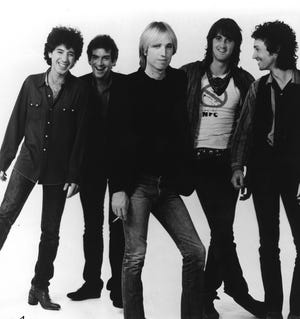 Milwaukee native Howie Epstein, left, pictured here with Tom Petty and the Heartbreakers in a 1983 press photo, played bass for the band for 20 years. Epstein, who died in 2003, is celebrated on a new album of '70s demos, "The Music of Howie Epstein Vol. 2," released by his brother Craig.
