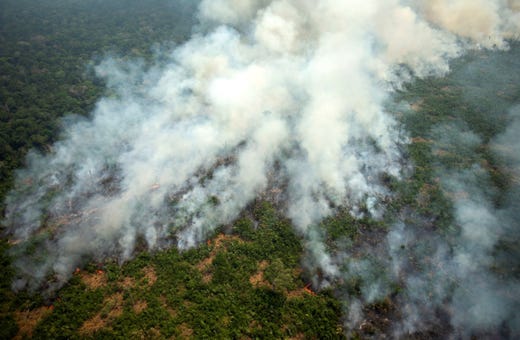 Aerial view of smoke from the Amazon forest during a fire in Porto Velho, Rondonia, Brazil, Aug. 23, 2019. The smoke of the fires covers the area causing poor visibility affecting air traffic.