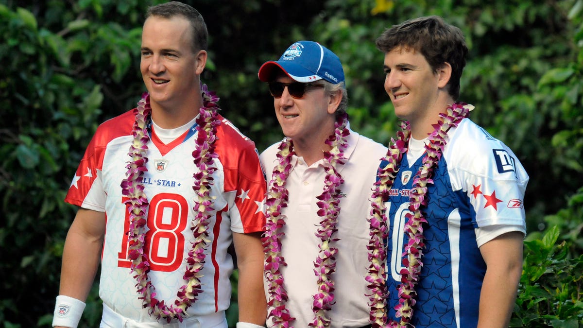 Archie Manning, center, with sons Peyton Manning and Eli Manning in 2009.