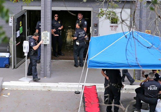 A Sept. 13, 2017 file photo shows a police staging area at the south entrance of the Rehabilitation Center at Hollywood Hills where residents died, in Hollywood.  The aftereffects of 2017's Hurricane Irma appear to have killed more than 400 senior residents of Florida nursing homes, a new university study shows.