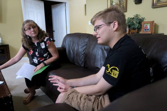 Tim Rohrer is shown with his mother Amy during an interview Tuesday, August 27, 2019, at their Millstone Township home.  Tim has autism and has become a sought-after speaker since he published a guide on how to treat people with disabilities. 