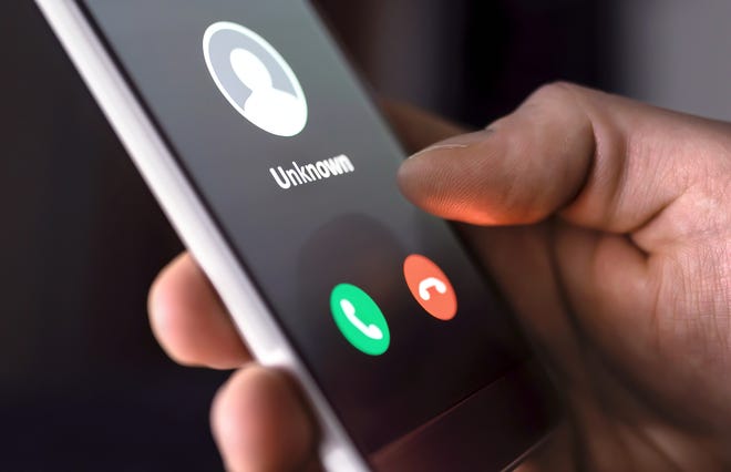 A photo showing a phone call from an unknown number on someone's cellphone. School officials in both Carson City and Washoe County are warning local businesses of 'sponsorship' scammers claiming to raise money for schools.