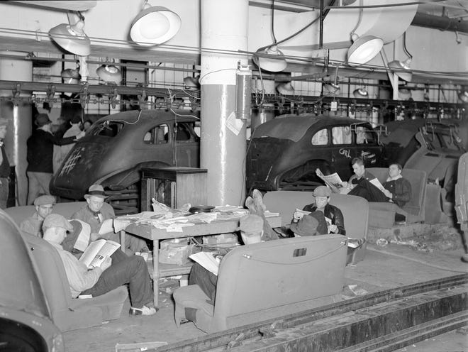 Striking autoworkers sit on car seats inside a GM factory in Flint in 1937.  The 44-day strike, historians agree, would become the most important strike in American labor history. 