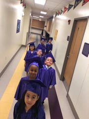 Borgwardt's 2018-2019 K5 Graduates making their way down the hallway of Rocketship Southside Community Prep to cross the stage.