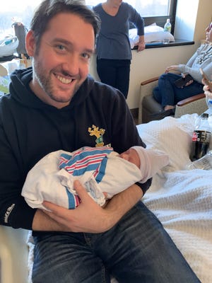 Sam Waisbren holds his newborn niece Charlotte Noa Waisbren after she was born earlier this year. Sam Waisbren was killed in an elevator accident in his Manhattan apartment building on Aug. 22.