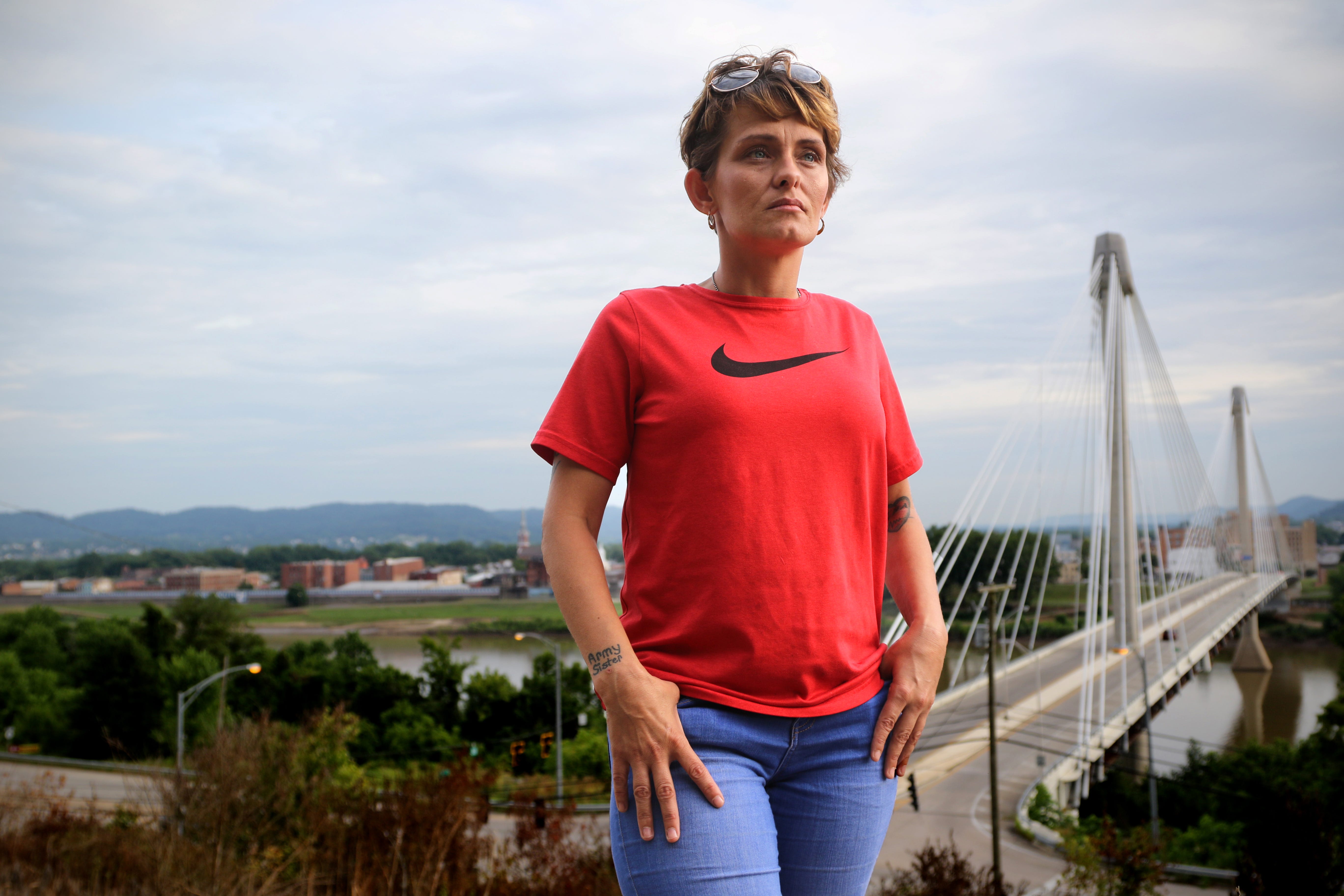 Linda Mills, 34, is photographed from an overlook across the river from Portsmouth, Ohio. Today she is doing what she always wanted. Serving in the military and representing her state.