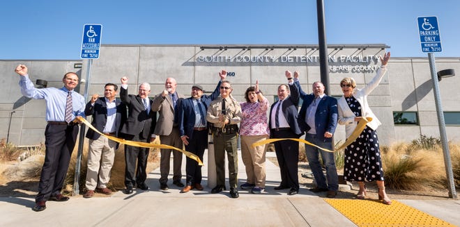 Tulare County Sheriff Mike Boudreaux, center and others celebrate during the unveiling of the new South County Detention Facility in Porterville on Wednesday, August 28, 2019.