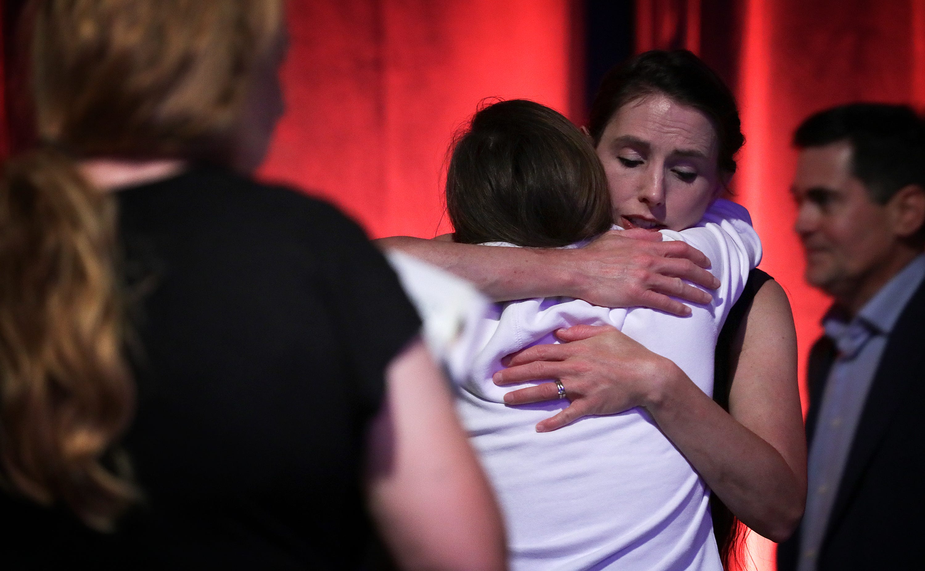 Rachael Denhollander hugs Madeline, an abuse survivor, after a panel discussion on abuse in the church the night before the Southern Baptist Convention opened in Birmingham, Alabama.