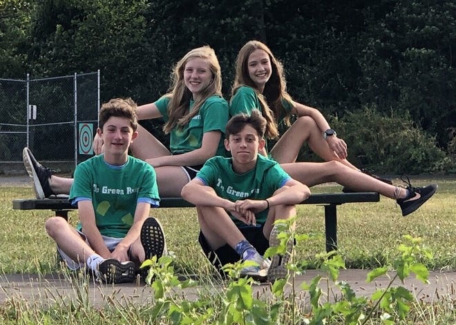 Former Bird Elementary students (clockwise from far left) Donovan Murphy, Libby Phillips, Isabell Kulick and Wesley Hart) completed a multi-year project that resulted in the building of an exercise path behind their former school.