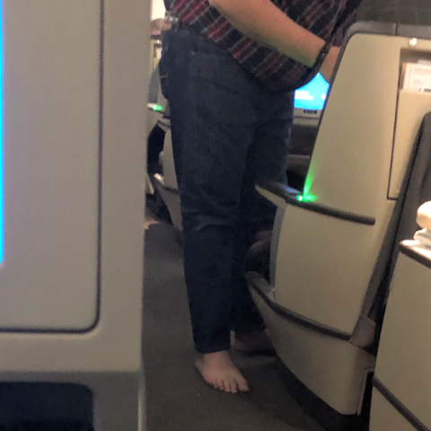 Barefoot on a plane.