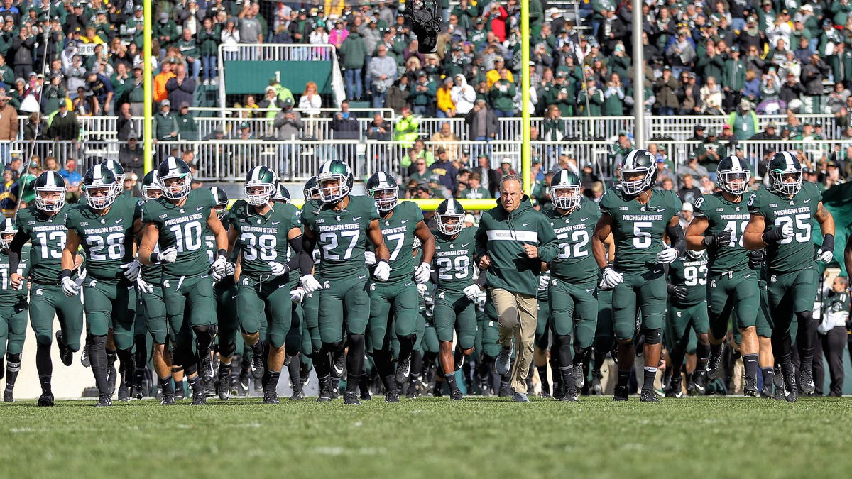 Michigan State Spartans head coach Mark Dantonio leads his team onto the field prior to a game against the Michigan Wolverines at Spartan Stadium n 2018.