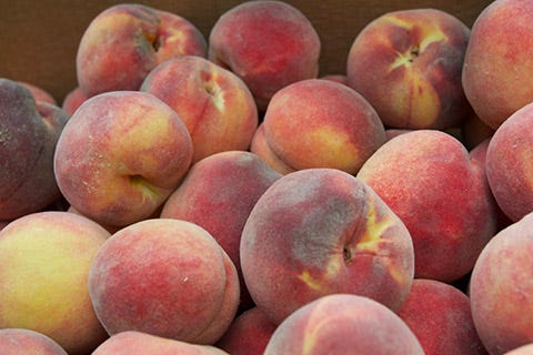 Locally-grown peaches delivered by the Southwest New Mexico Food Hub are destined for the cafeteria trays of students in Lordsburg. The newly awarded USDA Farm to School grant will expand sales of locally grown produce to the 8,200 public school students in seven public school districts in southwest New Mexico.
