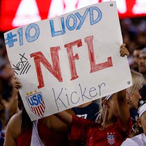 A fan holds up a sign for Carli Lloyd during an in