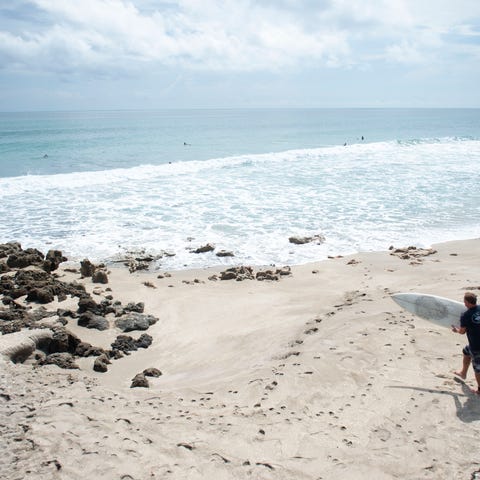 Surfers search for waves ahead of Hurricane Dorian
