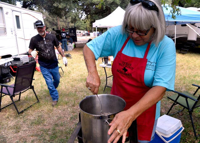 Bettie Barbieri stirs the meat for her chili in Buffalo Gap on Saturday. Her Down Home Cookin' team is competing in the 38th Annual Rentech Boiler Chili Super Bowl & Cookoff, which benefits Ben Richey Boys Ranch. The event will continue Sunday, starting with a church service led by Clay Jacobs at 9 a.m. and the awards announced at 5 p.m. Admission this year is free.