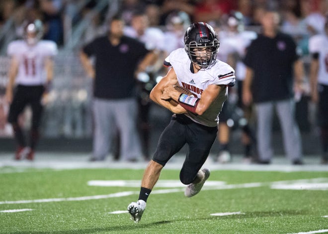 North Posey's Zach Lowe (9) carries the ball during the North Posey Vikings vs Mt. Vernon Wildcats Posey County rivalry game at Memorial Field Friday evening, Aug. 30, 2019. 