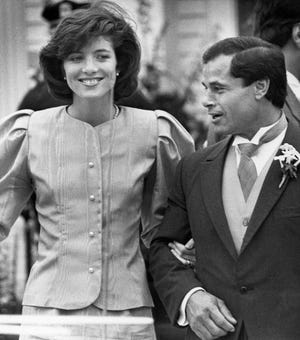 Maid of Honor Caroline Kennedy and Best Man Franco Columbu, leave St. Francis Xavier Church after the wedding of Caroline's cousin Maria Shriver to Arnold Schwarzenegger in Hyannis, Mass. on April 26, 1986.
