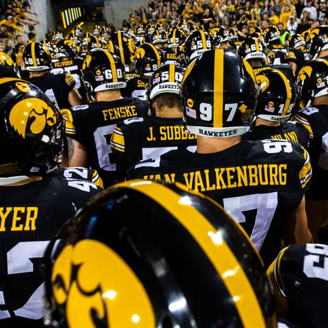 Iowa Hawkeyes players run into the tunnel after a 