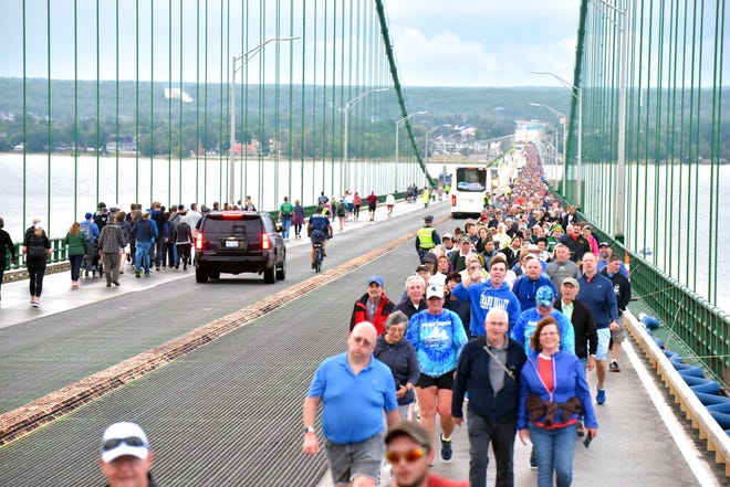 Pedestrians walk the Mackinac Bridge on Monday, Sept. 2, 2019, during the 62nd annual Labor Day Bridge Walk.