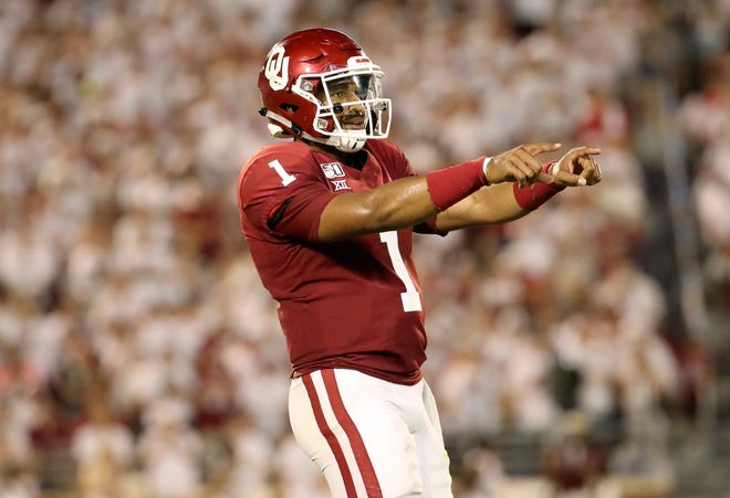 Oklahoma quarterback Jalen Hurts reacts after throwing a touchdown pass during the third quarter against Houston.