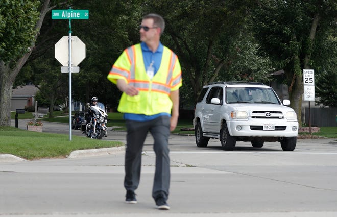 Brown County Principal Planner Cole Runge crosses a street in September 2019 at Edison Middle School in Green Bay. Local police plan a regional crosswalk education and enforcement event called "Operation Frogger" on Thursday in Green Bay and its suburbs. The event is to educate drivers to yield to pedestrians. File/USA TODAY NETWORK-Wisconsin