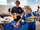 Christopher Fernstrom, 14, left, and Lisa Roland, right, sort through donations that will be taken to the Bahamas in the wake of Hurricane Dorian at Venue Naples on Tuesday, September 3, 2019. 
