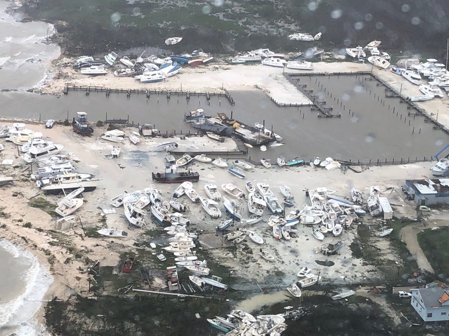 An aerial view shows destruction at a leisure boat harbor at the Bahamas after hurricane Dorian hit the islands on September 2, 2019.