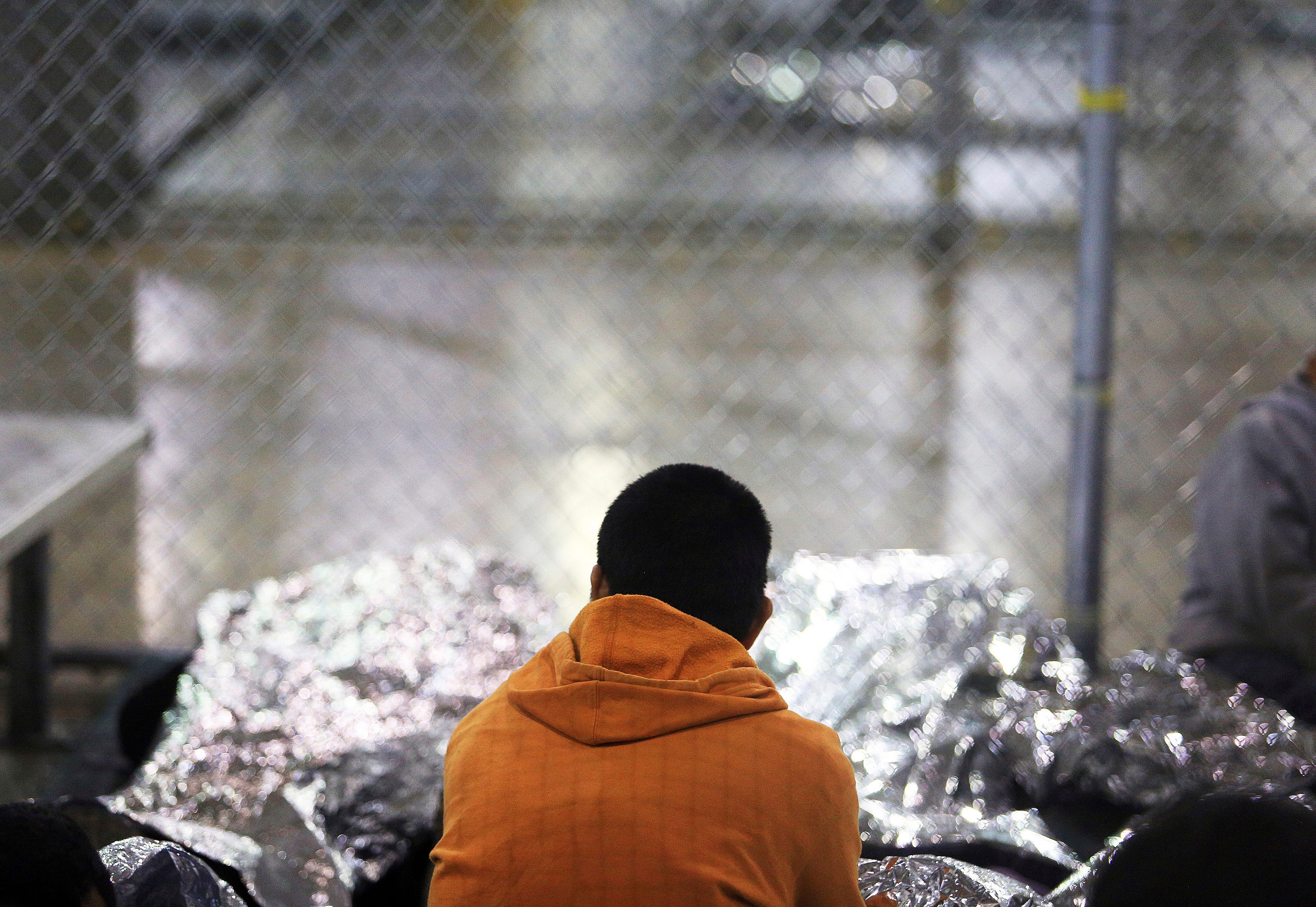 MCALLEN, TX – A detained immigrant waits in a holding cell at the Border Patrol's processing center in McAllen, Texas on Aug. 12, 2019.