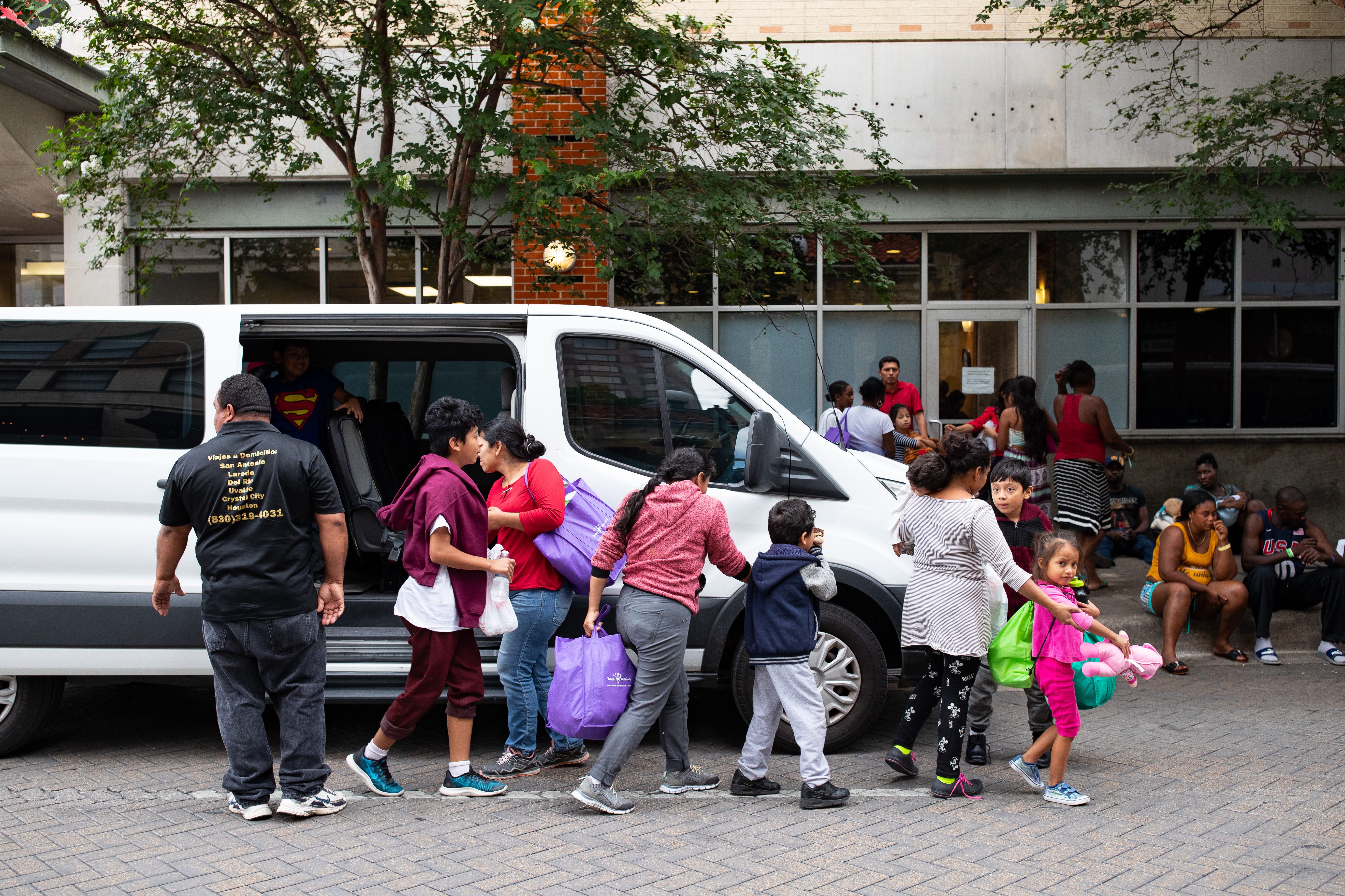 SAN ANTONIO, Texas – A group of migrants who recently crossed the U.S.-Mexico border are dropped off at the San Antonio Migrant Resource Center, where they will arrange travel to their final destinations in the United States, on June 27, 2019.