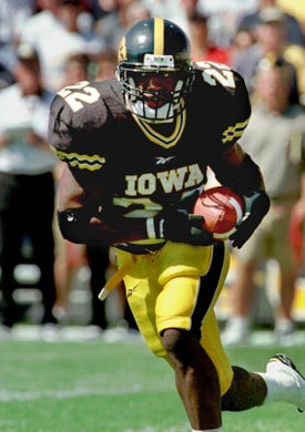 Iowa's Tavian Banks is wide open as he runs for 63-yd touchdown on first play fom scrimmage in game against Northern Iowa.