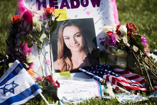 A photo of Meadow Pollack,19, was set up at one of the crosses that has been erected at the Parkland, Florida, amphitheatre in February 2018.