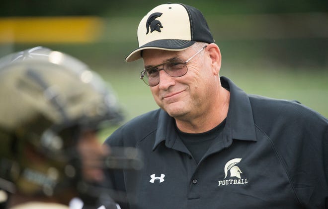 Deptford High School football coach Al Orio speaks with his players prior to the season opening game between Deptford and Cherry Hill East, played at Cherry Hill West High School on Thursday, September 5, 2019.  Deptford defeated Cherry Hill East, 44-6.