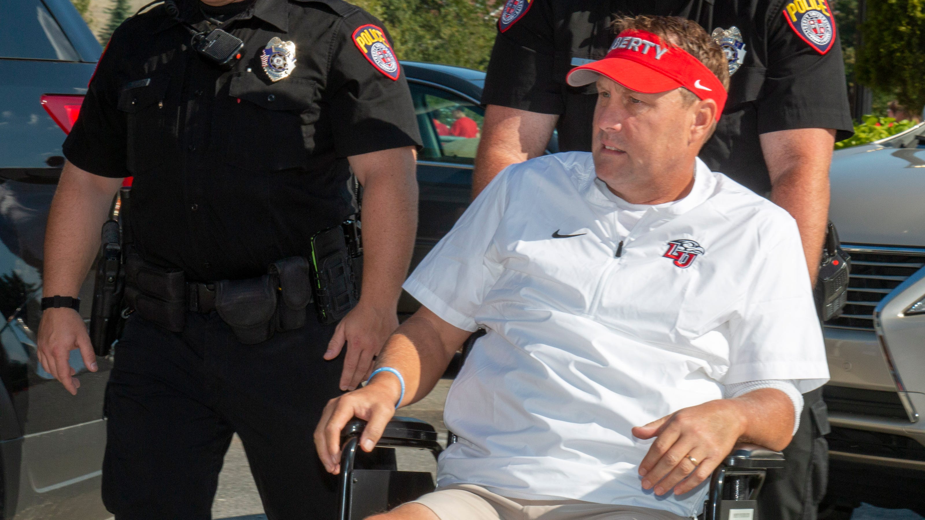 College football: Liberty coach Hugh Freeze to use medical chair