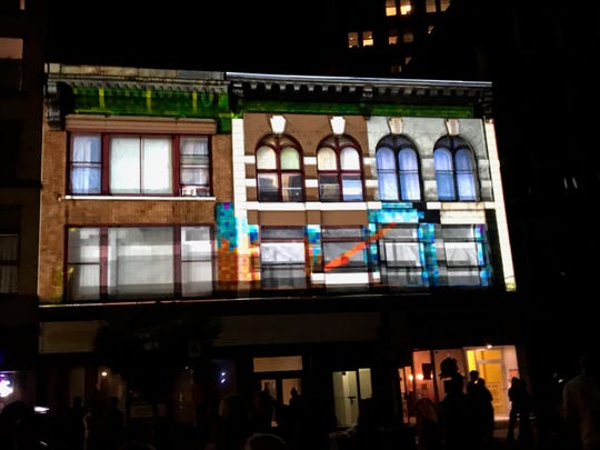 "All Your Building Are Belong To Us" gave participants a chance to play retro video games a the LUMA Projection Arts Festival.