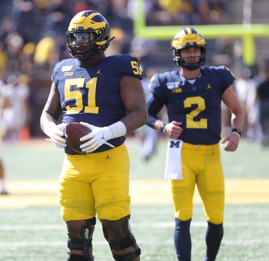 Michigan center Cesar Ruiz warms up before action against the Army Golden Knights Saturday September 7, 2019 at Michigan Stadium in Ann Arbor, Mich.