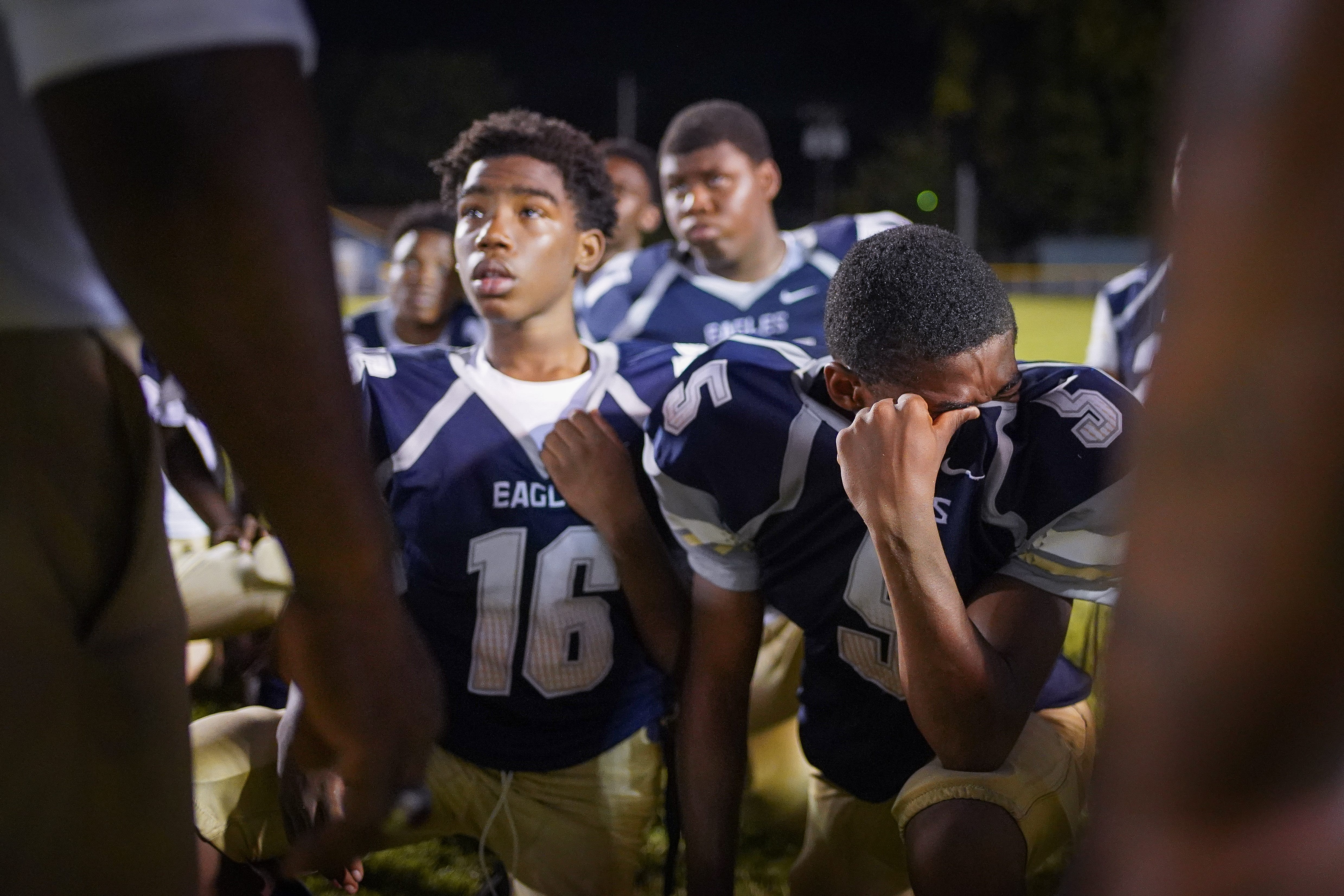 Academy @ Shawnee players react emotionally after being defeated by Seneca on Sept. 6, 2019.