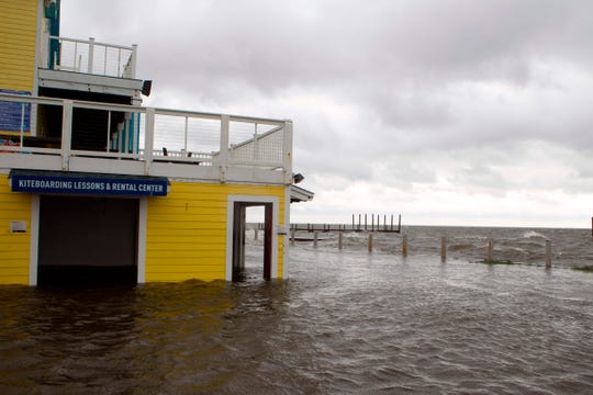 A flooded shop is seen next to Rodanthe Sound as Hurricane Dorian hits Cape Hatteras in North Carolina on September 6, 2019. - The final death toll from Hurricane Dorian in the Bahamas could be "staggering," a government minister has said as the storm lashed North Carolina in the US Friday with torrential rain and fierce wind.