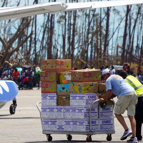 Sep 7, 2019; Treasure Cay, Bahamas;  People unload