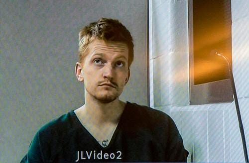 Jared Chance appears on a monitor during a video arraignment at the Kent County Courthouse in Grand Rapids.