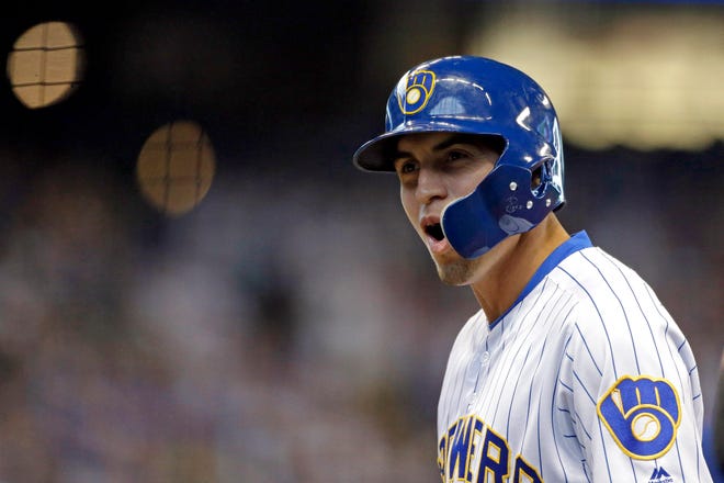 Milwaukee Brewers' Tyrone Taylor reacts after hitting an RBI-single during the sixth inning of a baseball game against the Chicago Cubs Sunday, Sept. 8, 2019, in Milwaukee. It was Taylor's first hit in the majors. (AP Photo/Aaron Gash)
