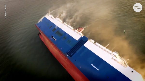 Coast Guard rescuers search capsized cargo ship fo