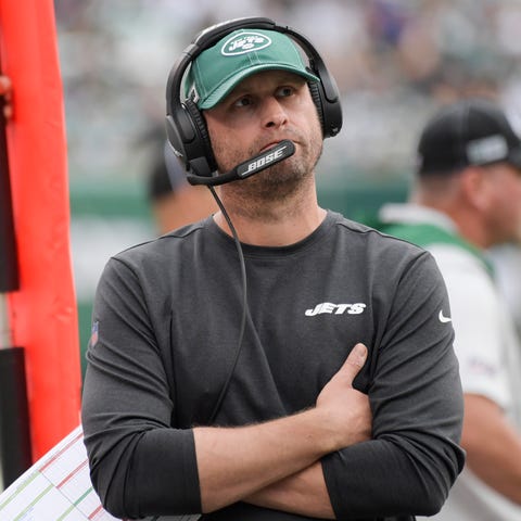 New York Jets head coach Adam Gase looks at the sc
